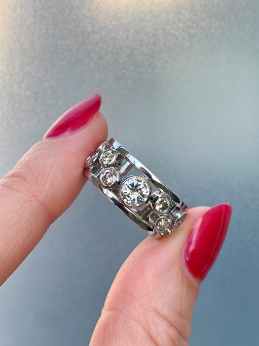 Platinum bespoke ring created by remodelling inherited diamond jewellery into a modern open-frame design.