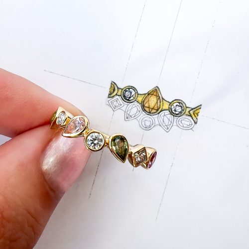 Unique bespoke jewellery alongside artist’s design drawings