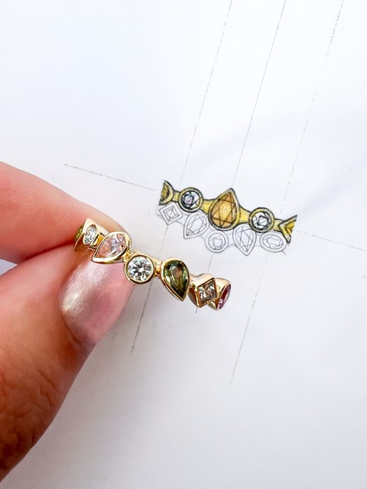 Unique bespoke jewellery alongside artist's design drawings