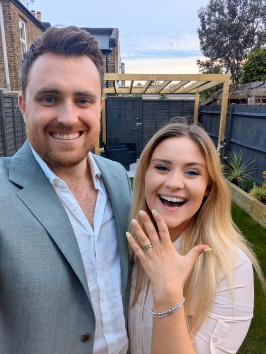 Bride and groom displaying bespoke custom wedding ring