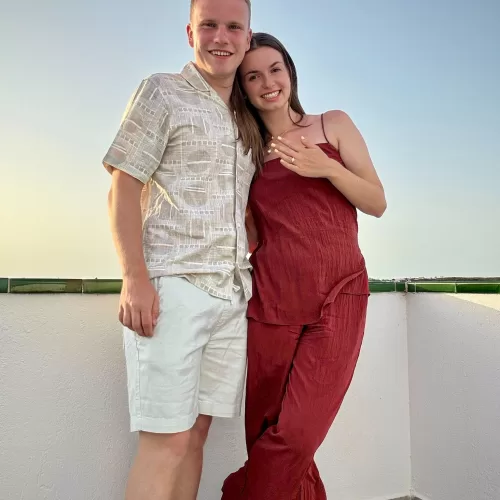 Happy couple showing new custom design bride’s wedding ring