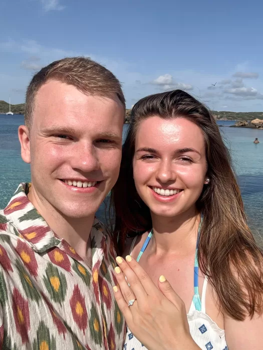 Happy couple showing new custom design bride's wedding ring