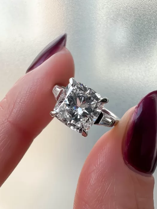 Bespoke jewellery between fingers