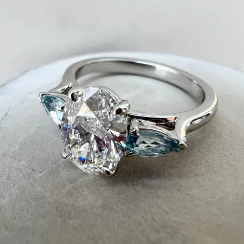 Oval Diamond and Aquamarine Bespoke Three-Stone Engagement Ring