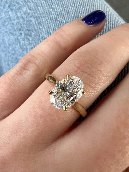 Oval Diamond Custom Engagement Ring on hand