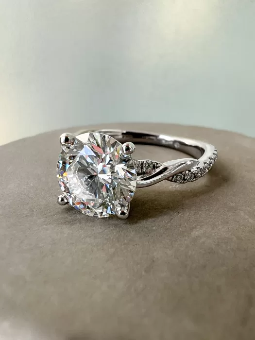 Custom Solitaire Engagement Ring on stone background