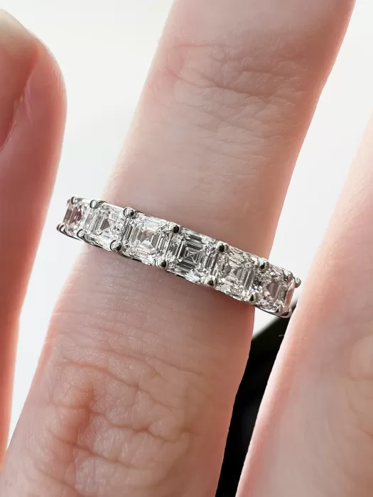 Asscher Cut Diamond Bespoke Wedding Ring on finger