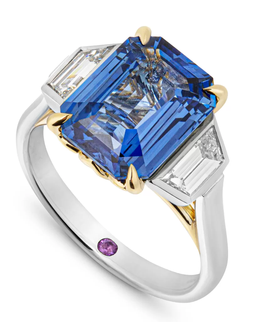 Bespoke sapphire engagement ring with diamond side stones
