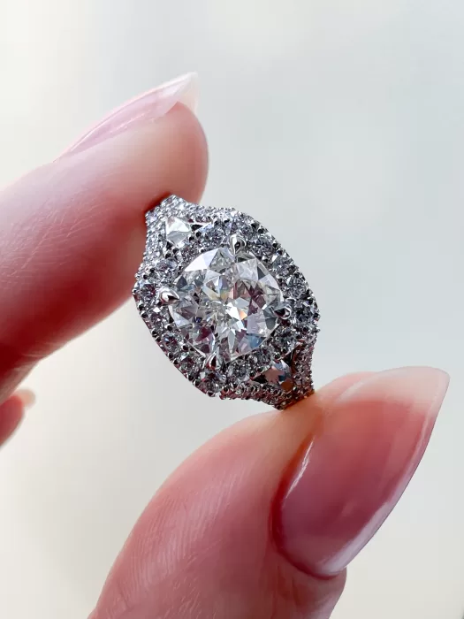 Old Cut Diamond Dress Ring held between fingers