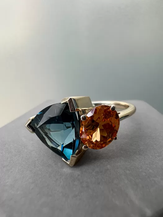 Toi et Moi Custom Dress Ring on concrete surface