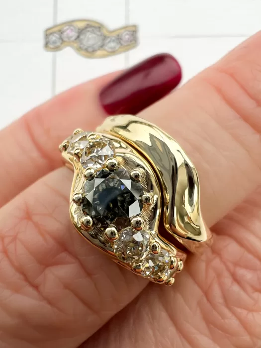salt and pepper diamond bespoke engagement ring and wedding ring on finger