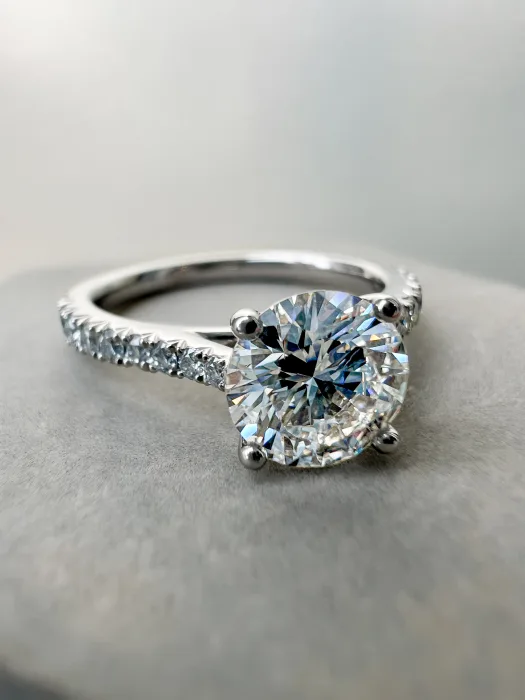 Platinum Solitaire Engagement Ring on table