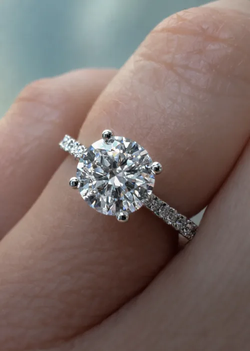 Platinum Solitaire Engagement Ring on finger