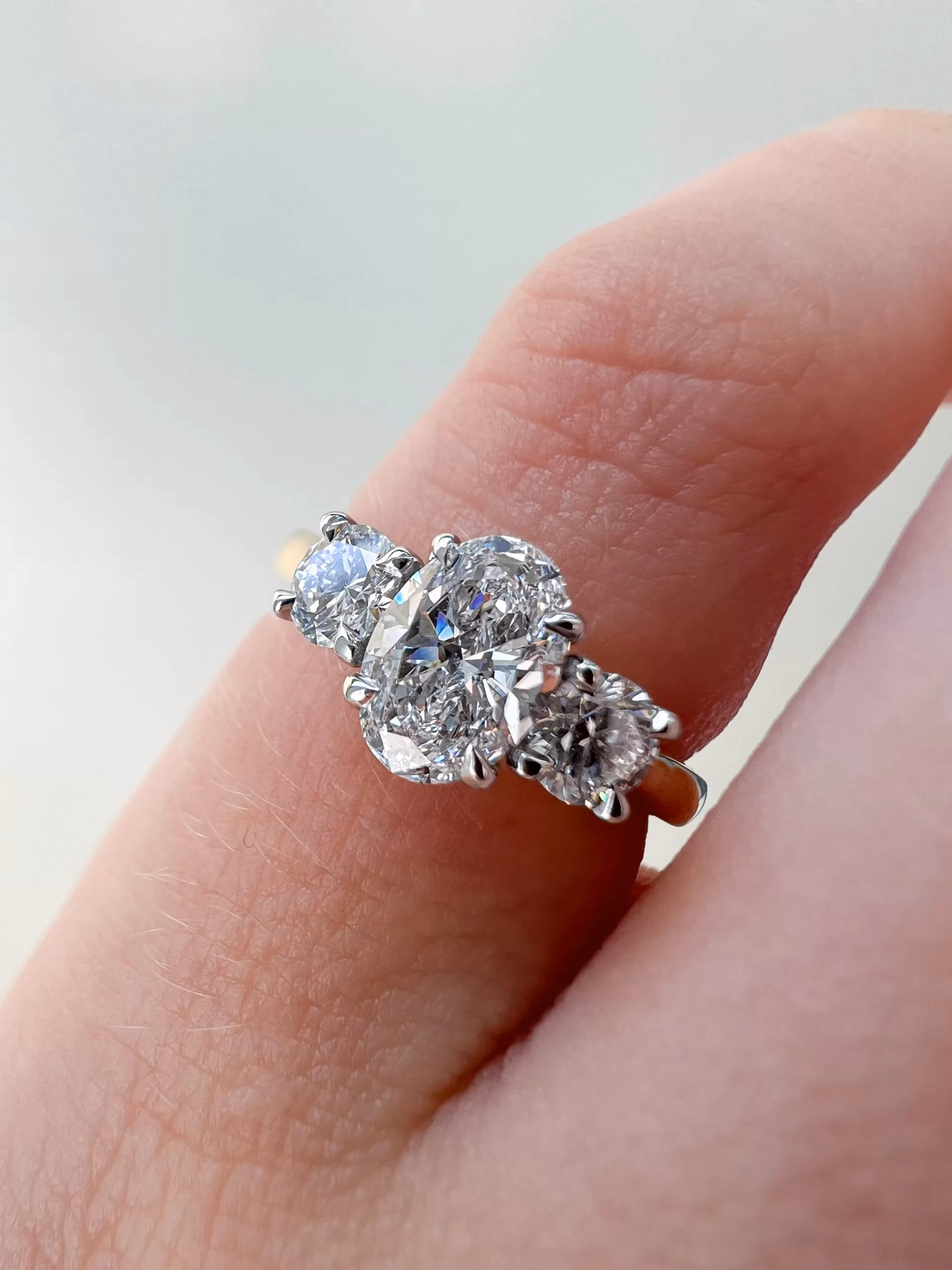 Bespoke Three Stone Engagement Ring on finger